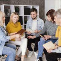 group-people-reading-books-therapy-session group-people-reading-books-therapy-session